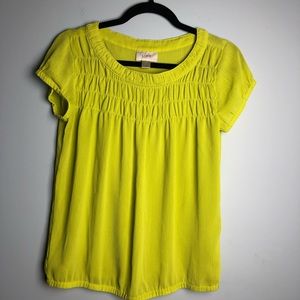 Gently used top, with smocking in front.